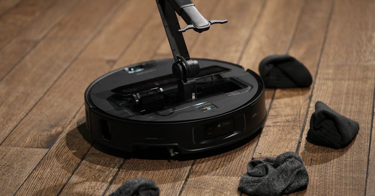 this-robovac-has-an-arm-that-can-pick-up-your-dirty-laundry